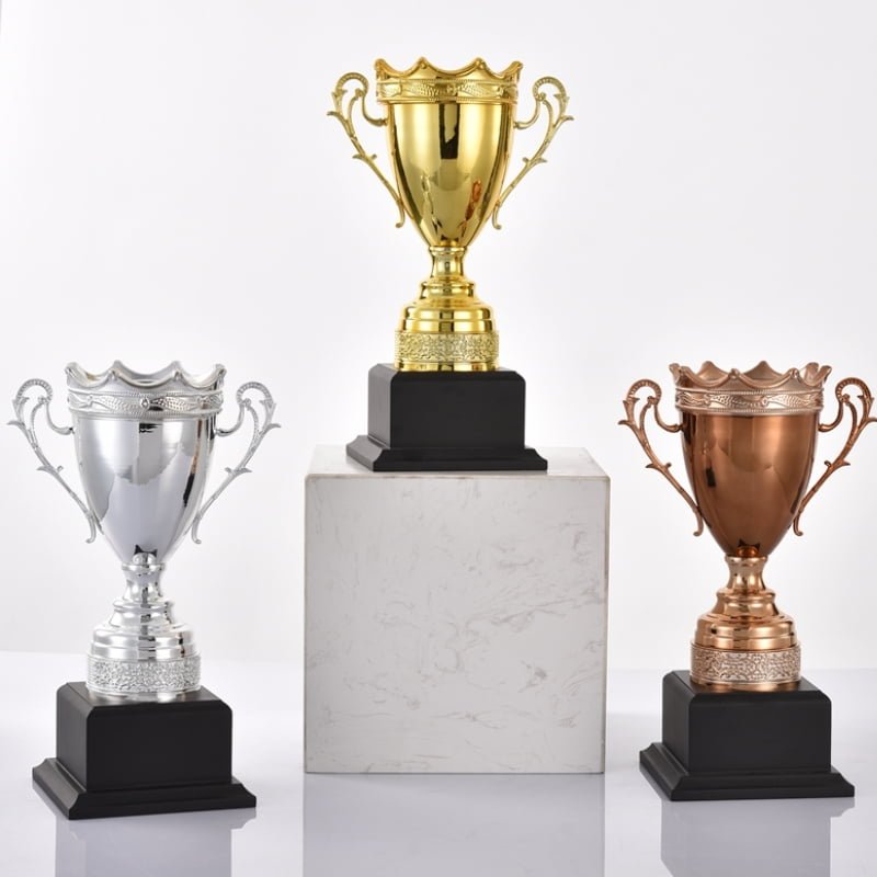 Gold, silver and copper metal trophy